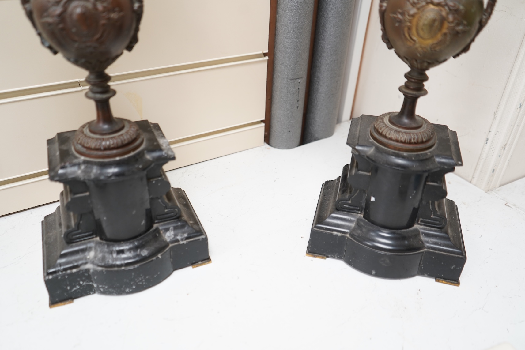 A pair of early 20th century bronze and black slate five light, four branch candelabra, 60cm high